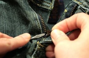 4) Sometimes the edge of the zipper is a little thick to easily slide into the side of the slider. You can use a narrow screwdriver to push the edge in.